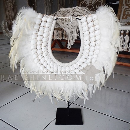 Balishine: Your natural source of indonesian handicraft presents in its Home Decor collection the Balangan Tribal Necklace Feather Shell Decorative on Stand:12NUS878004:For ancient Indonesians, jewelry as such was an essential part of ceremonial dress.  Jewelry could be worn as a symbol of power and standing or to protect the wearer from spiritual harm. The shell and feather necklace makes for a spectacular eye-catching home decor piece.  Each necklace is one-of-a-kind and will no doubt make a statement in your home.  This beautifully?crafted necklace?is?handmade in Indonesia.