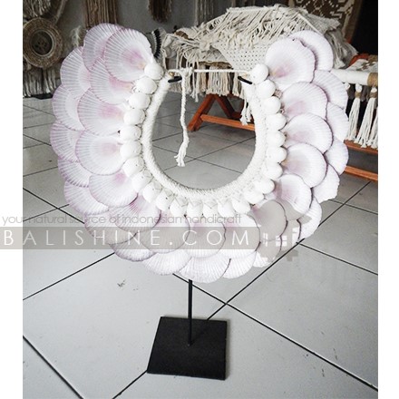 Balishine: Your natural source of indonesian handicraft presents in its Home Decor collection the Nyang Nyang Tribal Necklace Feather Shell Decorative on Stan:12NUS878005:For ancient Indonesians, jewelry as such was an essential part of ceremonial dress.  Jewelry could be worn as a symbol of power and standing or to protect the wearer from spiritual harm. The shell and feather necklace makes for a spectacular eye-catching home decor piece.  Each necklace is one-of-a-kind and will no doubt make a statement in your home.  This beautifully?crafted necklace?is?handmade in Indonesia.