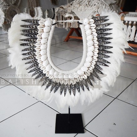 Balishine: Your natural source of indonesian handicraft presents in its Home Decor collection the Papua Shell Art Decor:12NUS877999:For ancient Indonesians, jewelry as such was an essential part of ceremonial dress.  Jewelry could be worn as a symbol of power and standing or to protect the wearer from spiritual harm. The shell and feather necklace makes for a spectacular eye-catching home decor piece.  Each necklace is one-of-a-kind and will no doubt make a statement in your home.  This beautifully?crafted necklace?is?handmade in Indonesia.