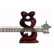 balishine This abstract statue is a handicraft of Bali made from suar wood.